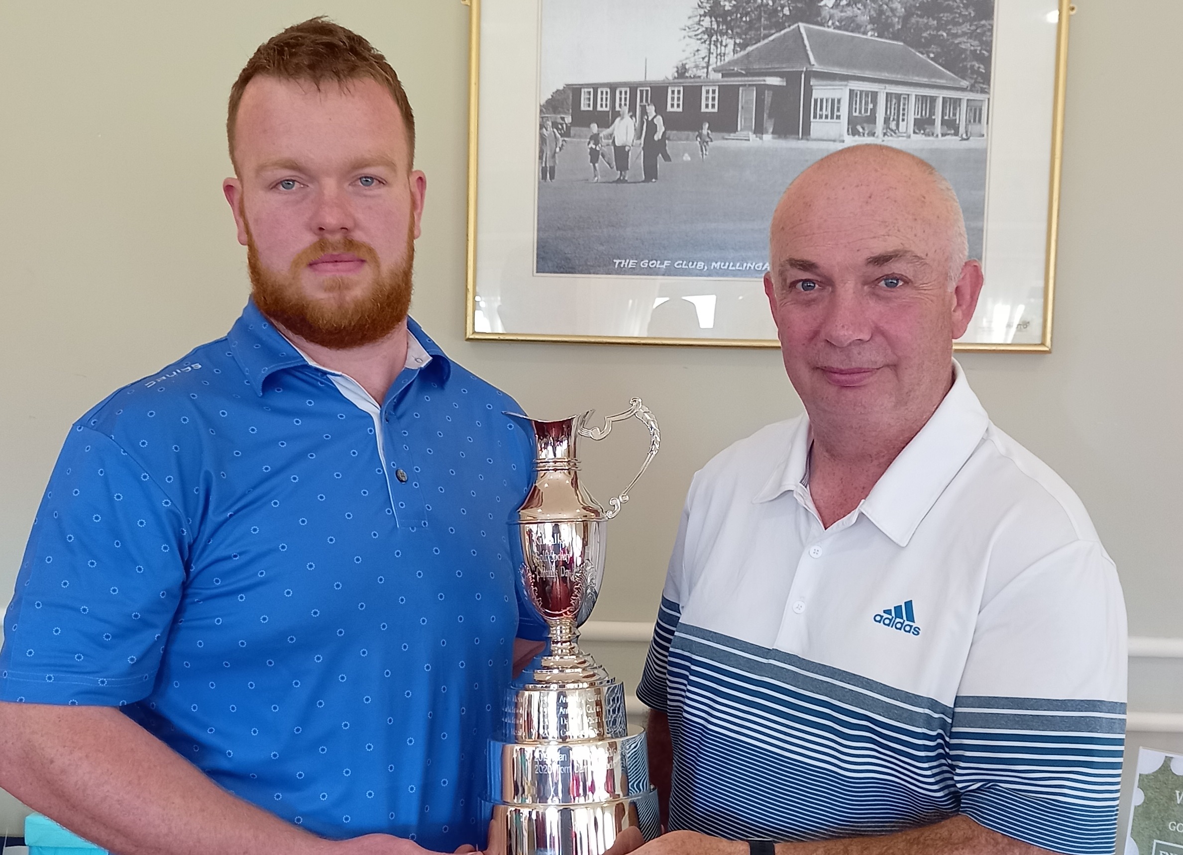 Captains winner James Moore (left) with Captain Chippy Quinn presenting.